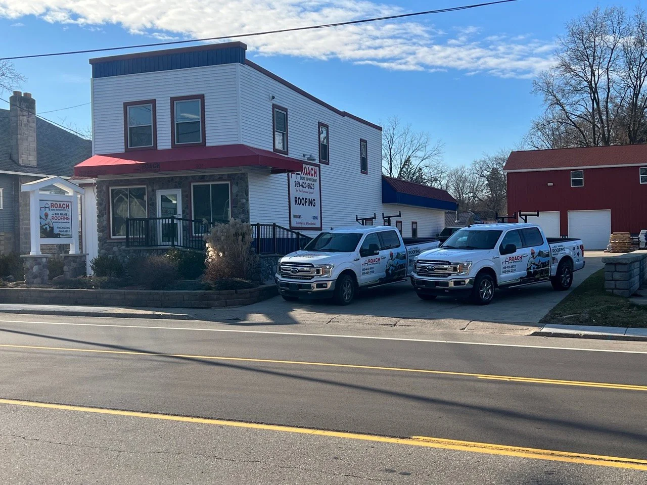 Roach Home Improvement office and company trucks