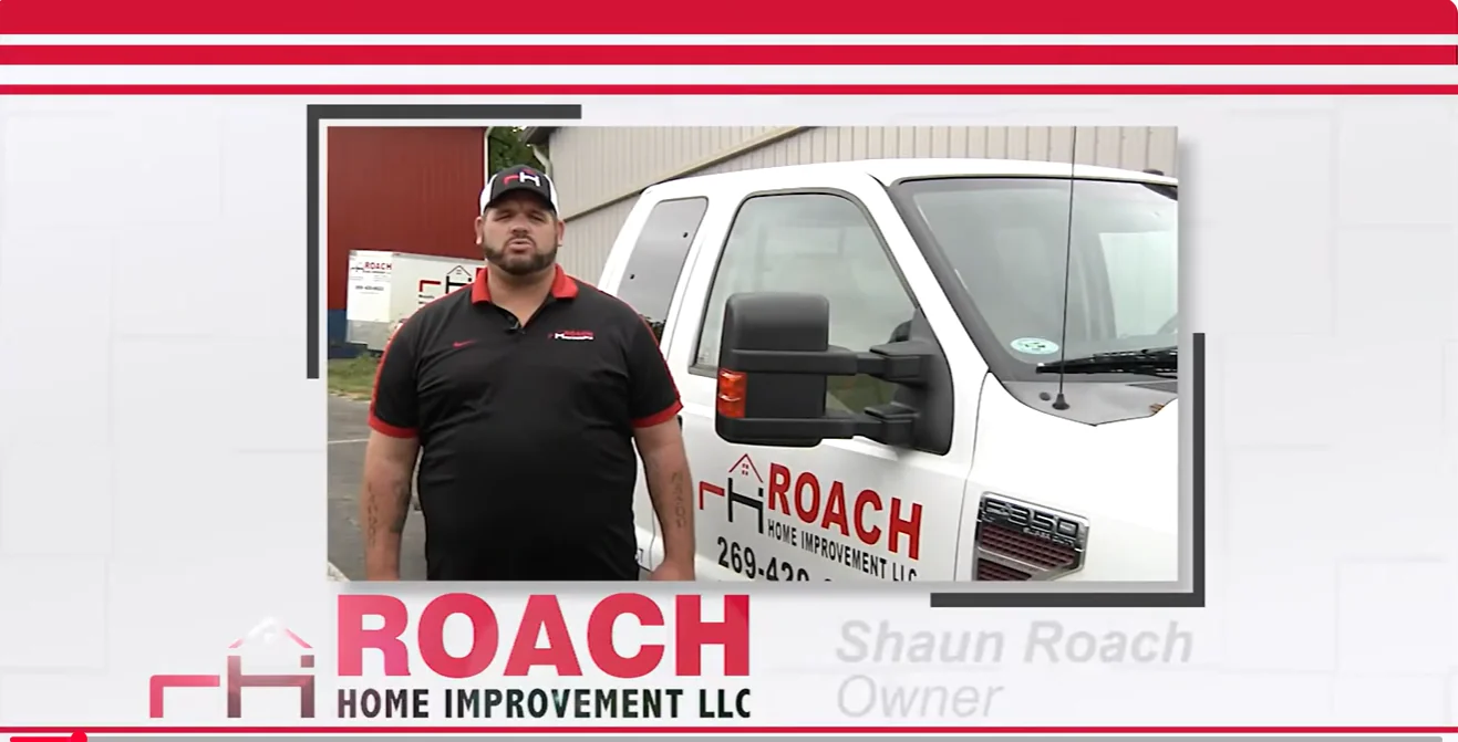 Shaun Roach beside a Roach Home Improvement truck