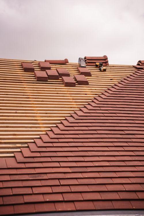 Clay tile roof being installed on battens in Wyoming, MI